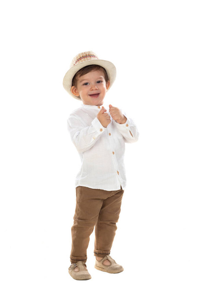 Cool stylish little boy in a hat. Isolated on white background - Photo, image