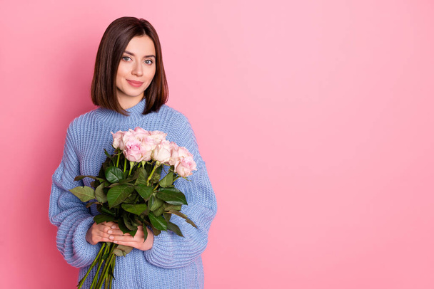 Portrait of gorgeous positive girl hands hold rose bouquet empty space isolated on pink color background. - Foto, Imagen