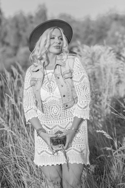 European blonde tanned woman in Boho style, enjoy the life. Life of happy nice natural beauty woman. Concept of vintage style - Fotó, kép
