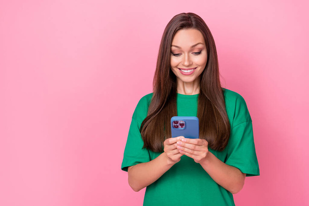 Portrait of lovely gorgeous adorable girl with straight hairdo wear green t-shirt writing message isolated on pink color background. - Фото, зображення