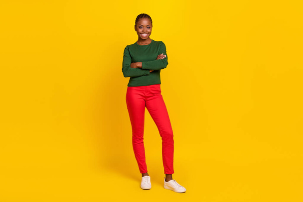 Full length photo of funny charming lady dressed green shirt arms crossed smiling isolated yellow color background. - Fotó, kép