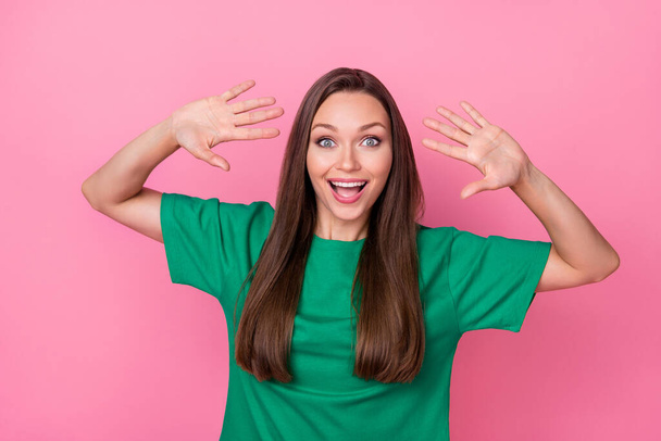 Photo of nice astonished person raise opened arms palms toothy smile isolated on pink color background. - Фото, изображение