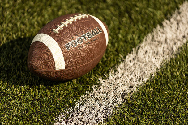 American football on football field background. - Photo, Image