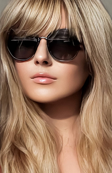 Luxury fashion, blonde hairstyle and accessories, beauty face portrait of a woman with long blond hair, wearing chic sunglasses, glamour style close-up - Photo, image