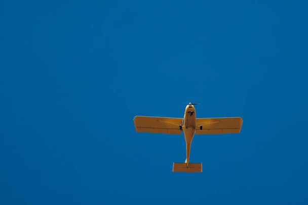 Yellow plane in flight. - Photo, Image