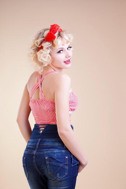 Sexy pin up girl in Jeans Shorts, isolated on white - Fotó, kép