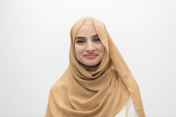 Portrait of young Muslim woman wearing hijab on isolated white background. High quality photo - Foto, Imagem
