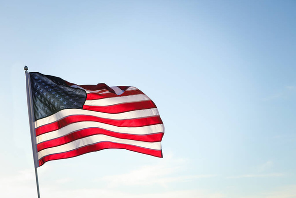 American flag fluttering outdoors on sunny day - Φωτογραφία, εικόνα