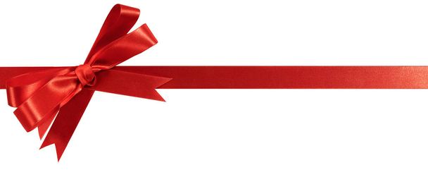 Red christmas gift ribbon and bow horizontal isolated white - Photo, Image