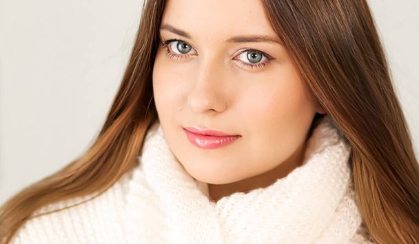 Autumn winter fashion and knitwear, beautiful woman wearing warm knitted scarf, close-up portrait - Фото, изображение