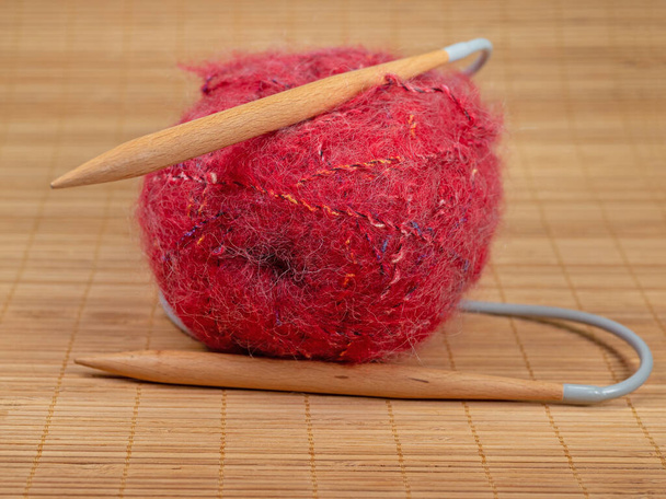 Red mohair wool and knitting needles - Photo, Image
