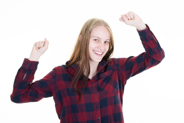 Encouraged and motivated cute blonde woman raising hands up fist pump from happiness smiling hear good news celebrating victory in winning huge bet over white background - Photo, Image