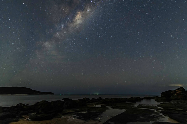 Milky Way and stars in the night sky at Killcare Beach, Central Coast, Australia. - Foto, afbeelding