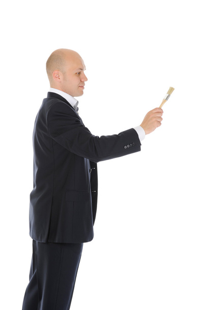 Businessman with a brush in his hand - Foto, afbeelding