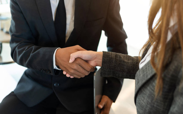 business coworkers join hands together during their partnership deal - Foto, imagen