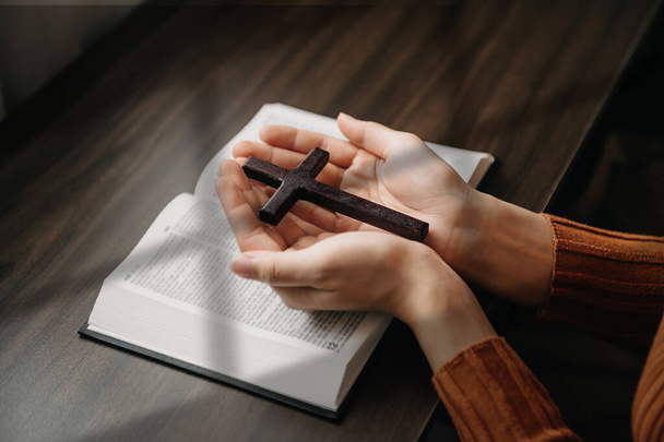 woman Hands holding cross and reading bible book  - Photo, Image
