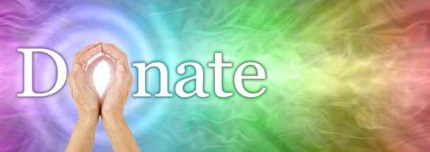 Rainbow spiral DONATE concept header - female hands cupped making the O of donate with a spiral behind the O and a rainbow coloured wide background ideal for a campaign header - Photo, Image