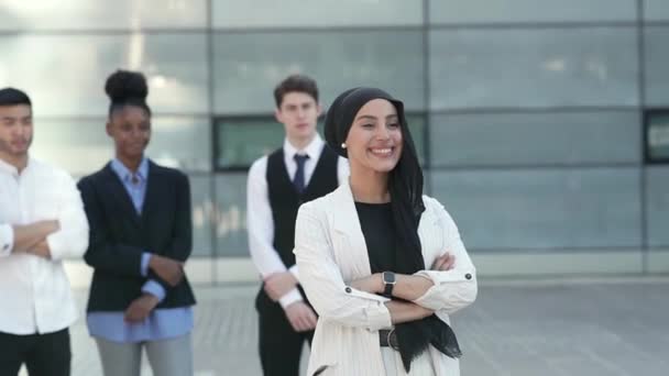 portrait of muslim arab businesswoman, and her team of workers outside - business concept - - Video