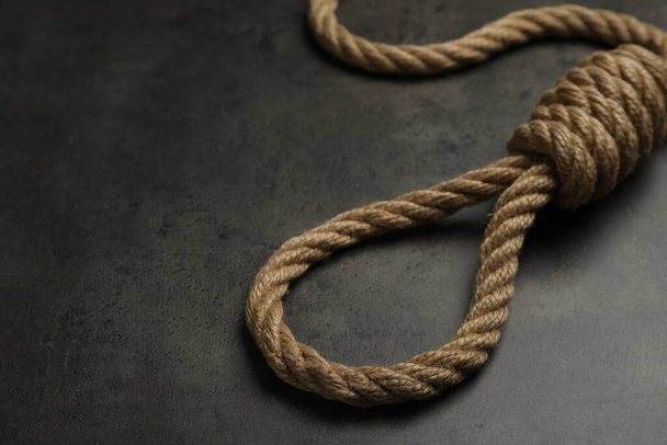 Rope noose with knot on grey table, closeup. Space for text - Foto, immagini