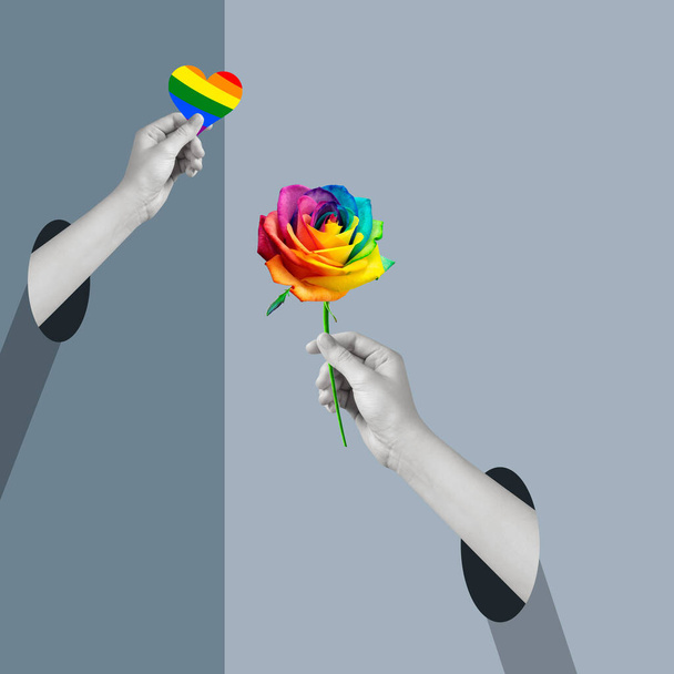 Ihmiskädet pitelevät ruusua ja sydäntä. Lesbojen, homojen, biseksuaalien ja transsukupuolisten symboli, LGBT. Nykytaiteen kollaasi. Ihmissuhteen käsite, yhteisö, monimuotoisuus, symboliikka, surrealismi. - Valokuva, kuva