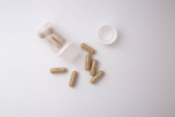 Pills with the badas, dietary supplement on a white background - Zdjęcie, obraz