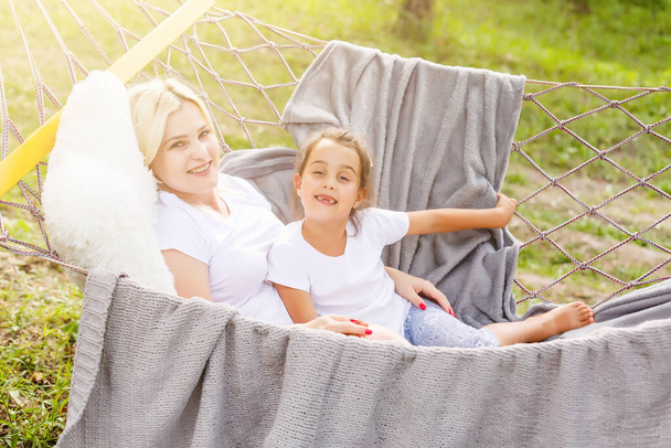 Portrait of family in a hammock - Photo, Image