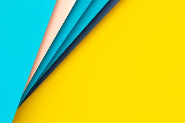 Abstract color papers geometry flat lay composition background with yellow, blue, pink color lines and shapes. Top view, copy space. - Foto, imagen