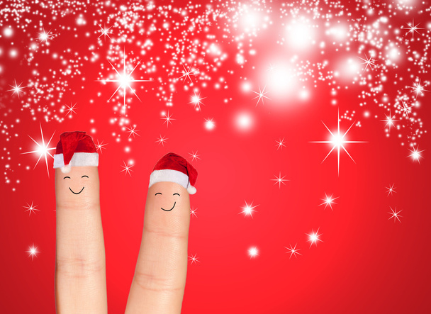 Facce delle dita nei cappelli di Babbo Natale
 - Foto, immagini