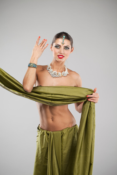 Young pretty woman in indian green dress - Фото, зображення
