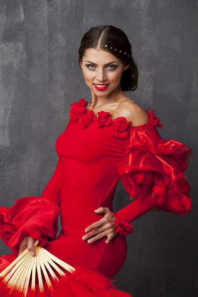 Woman traditional Spanish Flamenco dancer dancing in a red dress - 写真・画像