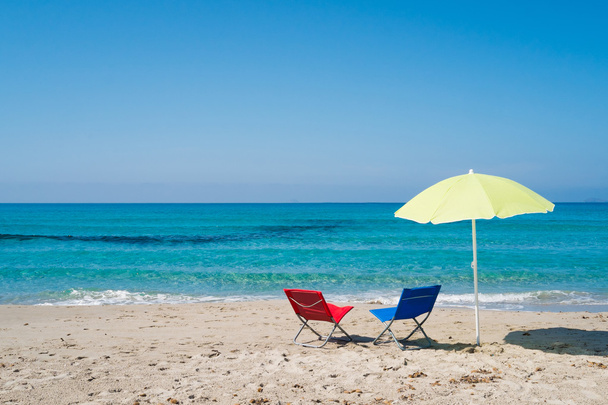 Beach umbrella and lounge chairs - Photo, Image