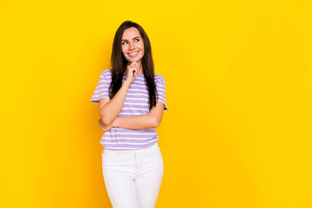 Portrait photo of young attractive minded businesswoman looking empty space how much profit she got isolated on yellow color background. - Φωτογραφία, εικόνα