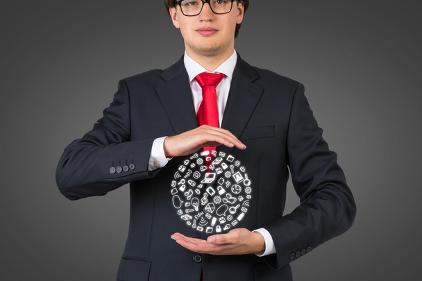 businessman holding social media icons - Foto, afbeelding