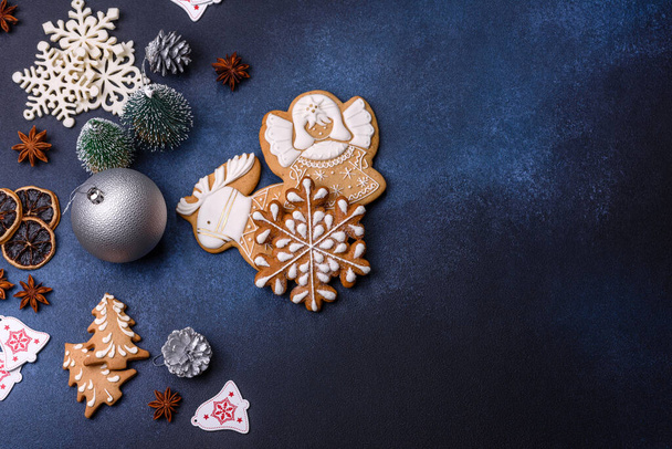 Christmas composition with gingerbread cookies, Christmas toys, pine cones and spices. Winter holidays background - Photo, image