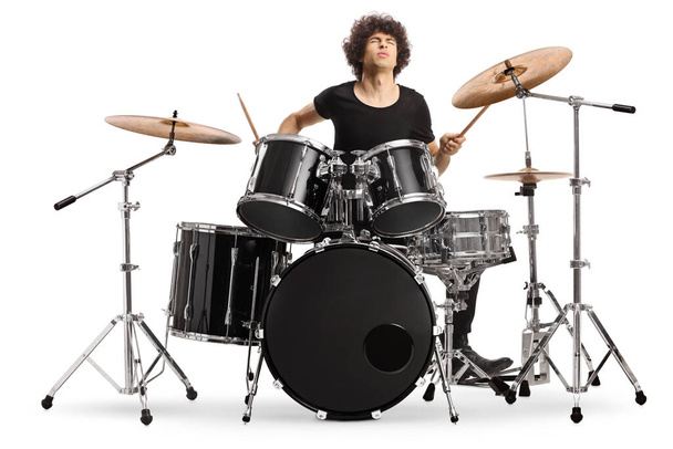 Young male drummer playing on stage isolated on white background - Foto, immagini