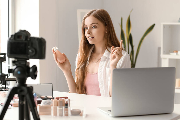 Female beauty blogger with perfume recording video in dressing room - Photo, Image