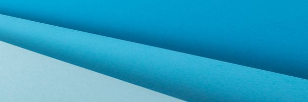 Цветная голубая сложенная бумага дизайн материала. Вид сверху, плоский. Баннер.  - Фото, изображение