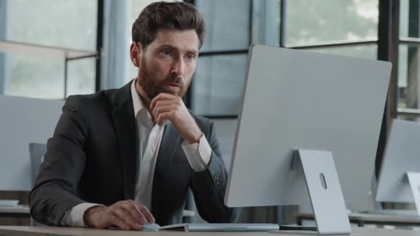 Caucasian bearded 40s middle-aged businessman worker employee man typing laptop feel failure upset with lost of information online error stressed look at computer screen suffer from headache pressure - Materiaali, video