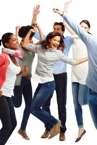 Стрибки з радістю. Група випадково одягнених молодих дорослих схвильовано стрибає на білому тлі
 - Фото, зображення