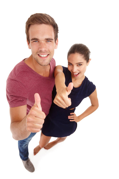 Youre okay in our book. High angle shot of a young man and woman giving thumbs up - Foto, immagini
