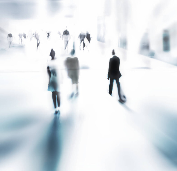 Rushing through the daily grind. Blurred shot of a businesspeople commuting - Foto, Bild