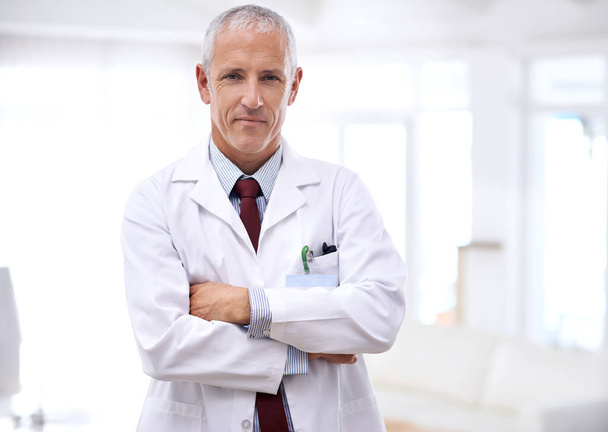 Your health is my number one priority. Portrait of a mature doctor standing with his arms crossed - Фото, зображення