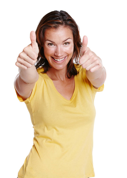 Thats a great idea. Cropped studio portrait of a woman showing two thumbs up and smiling at the camera isolated on white - Foto, afbeelding