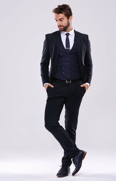 Handsome and successful. Studio shot of a well-dressed man against a gray background - Foto, Imagem