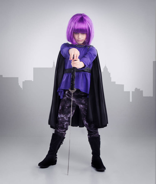 Shes a force to be reckoned with. A studio shot of a confident little girl playing dress-up - Photo, Image