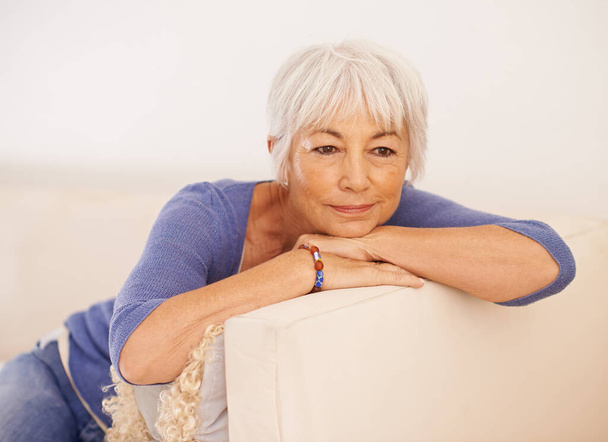 Taking it easy this weekend. a mature woman relaxing on a couch - Photo, Image