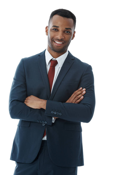 Feeling buoyant about his future. A handsome smiling businessman with his arms folded while isolated on white - Foto, Imagem