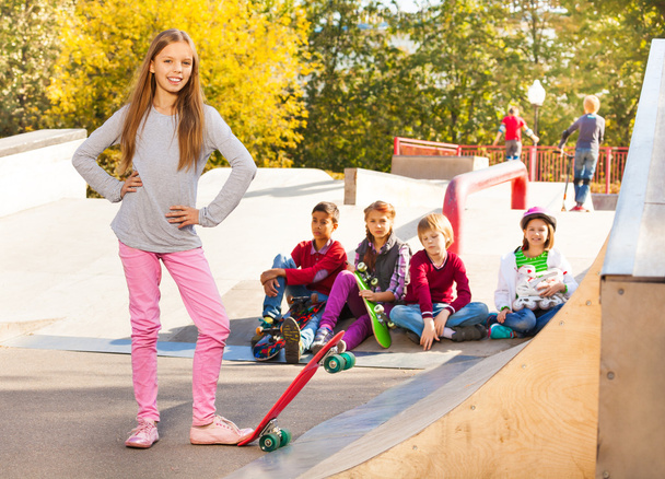 Blond girl with skateboard - Фото, зображення