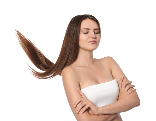 Young woman with strong healthy hair on white background - Foto, Imagen