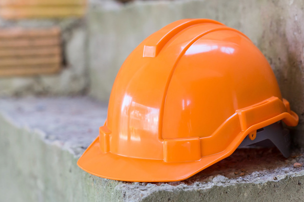 orange safety helmet, safety equipment of construction worker - Fotó, kép